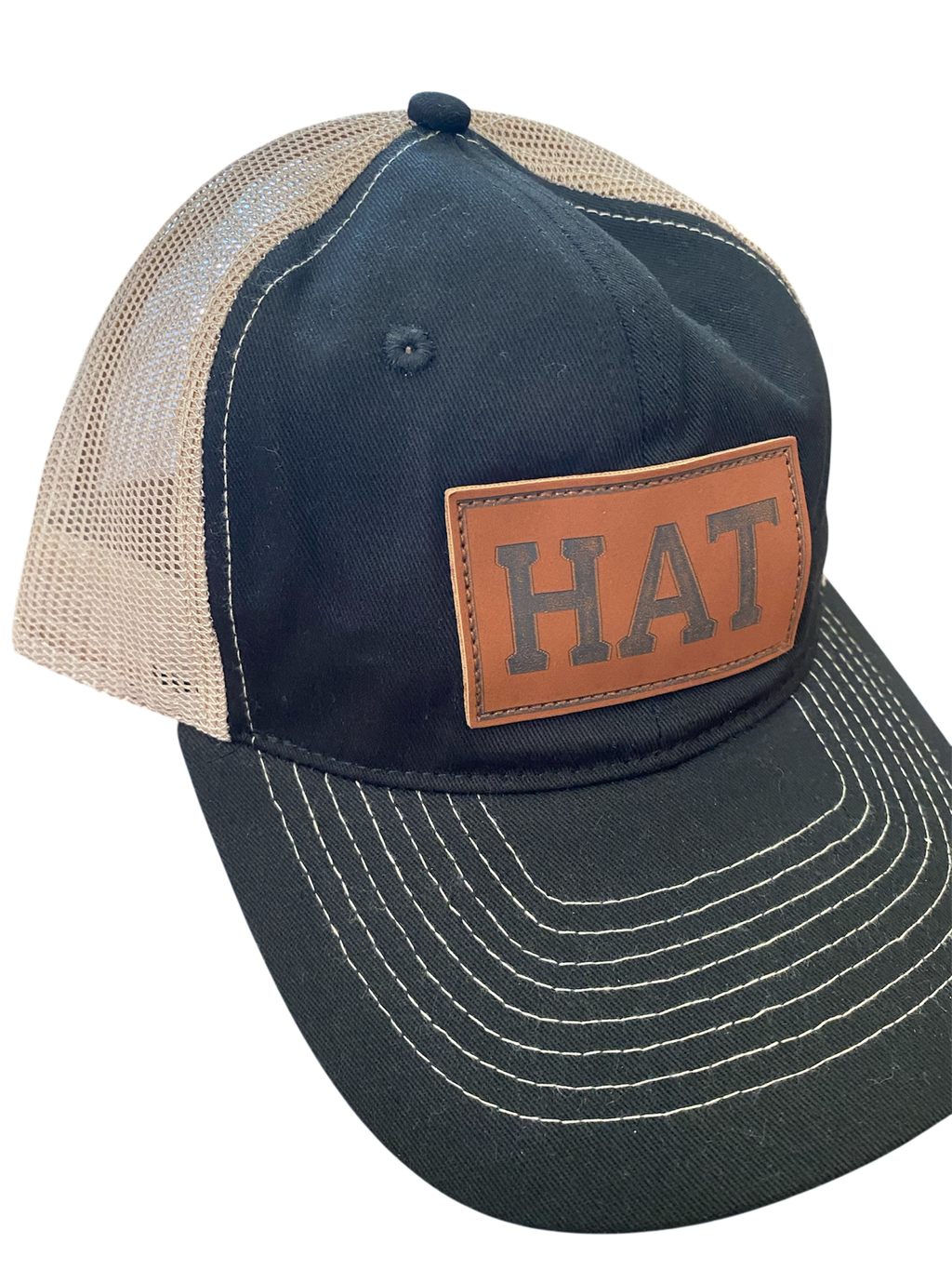 SaHC unstructured trucker hat in black/off-white mesh with faux leather HAT patch