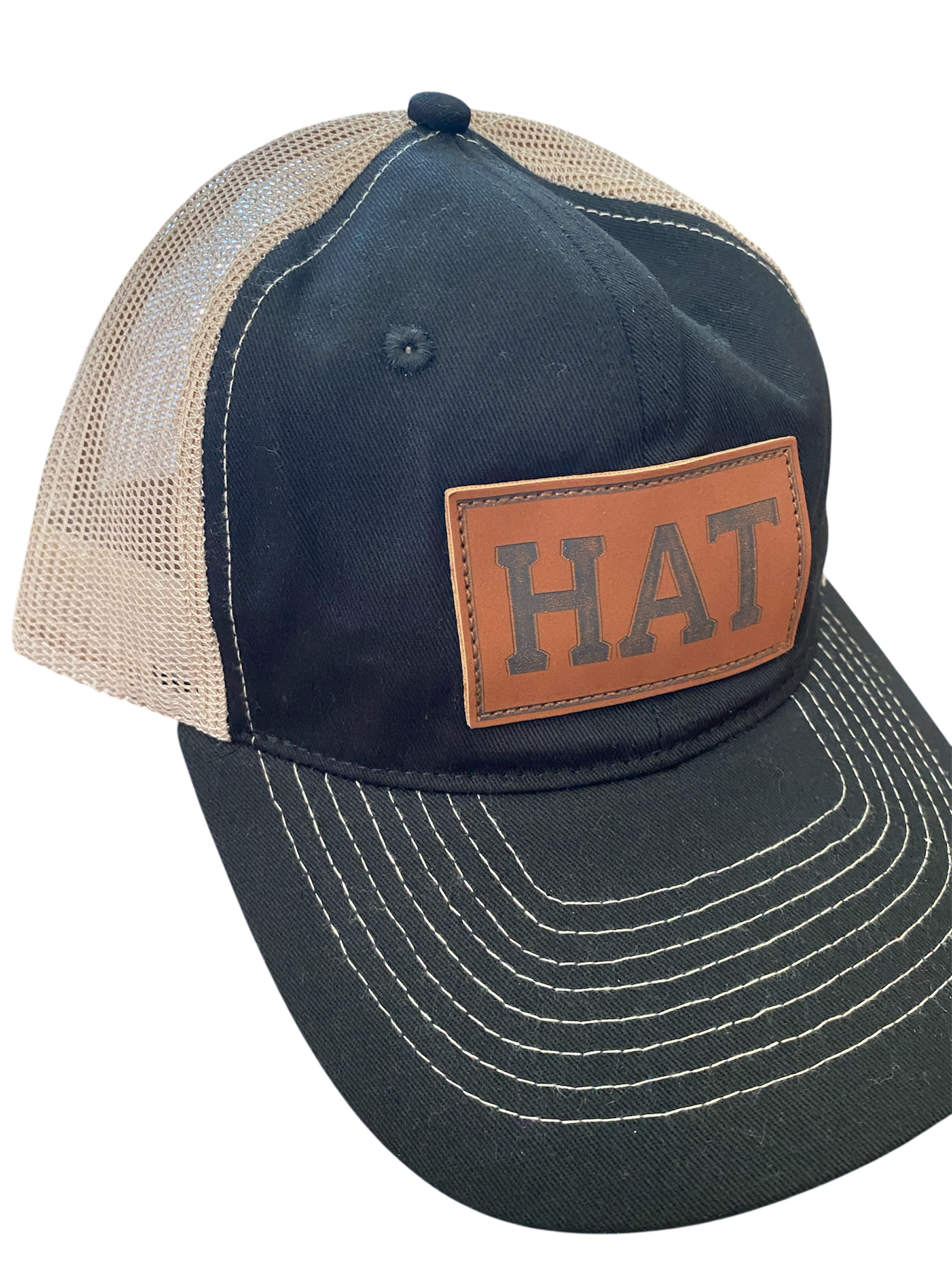 SaHC unstructured trucker hat in black/off-white mesh with faux leather HAT patch