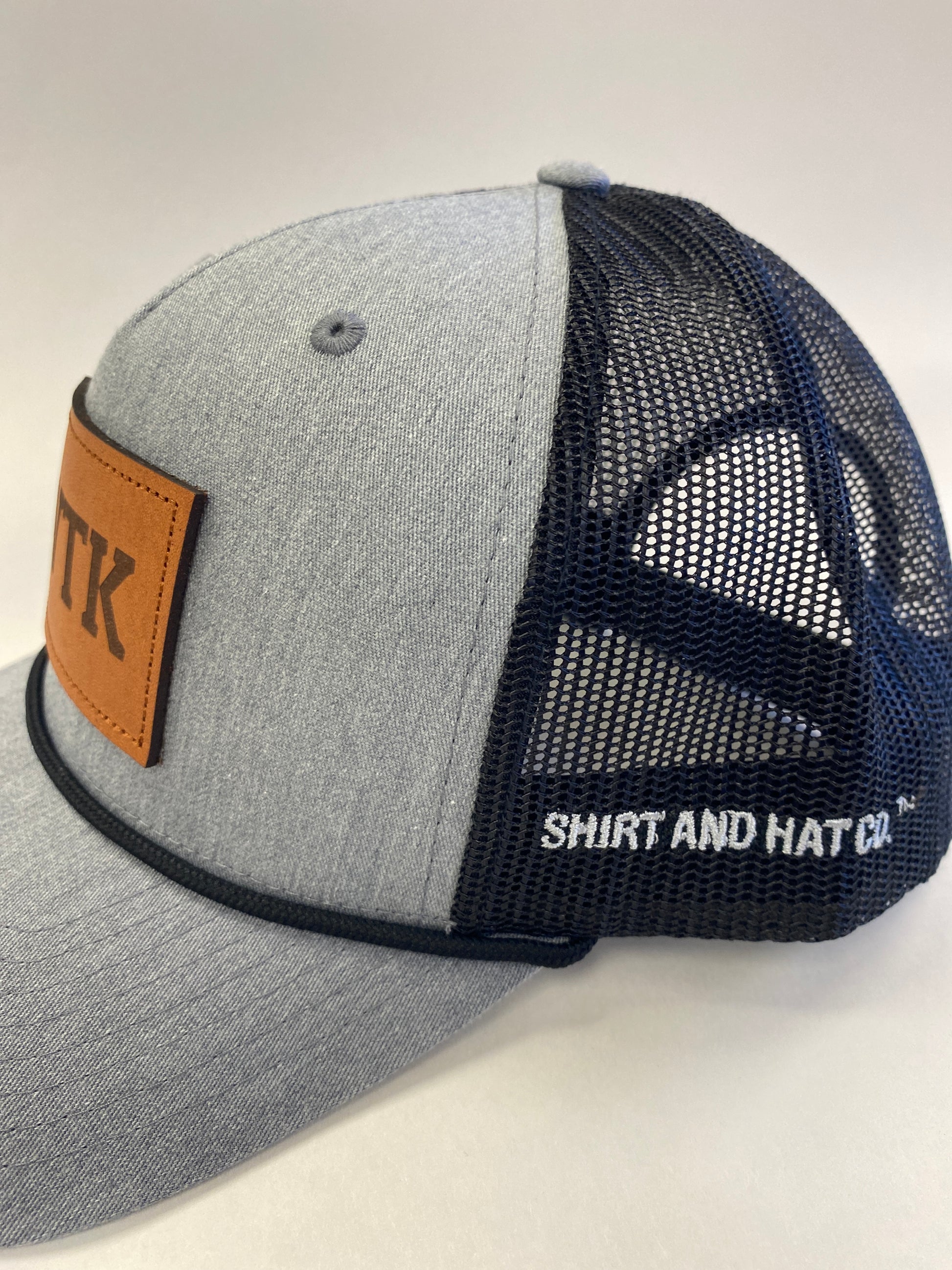 Leather Patch WTK Trucker Hat in black rope