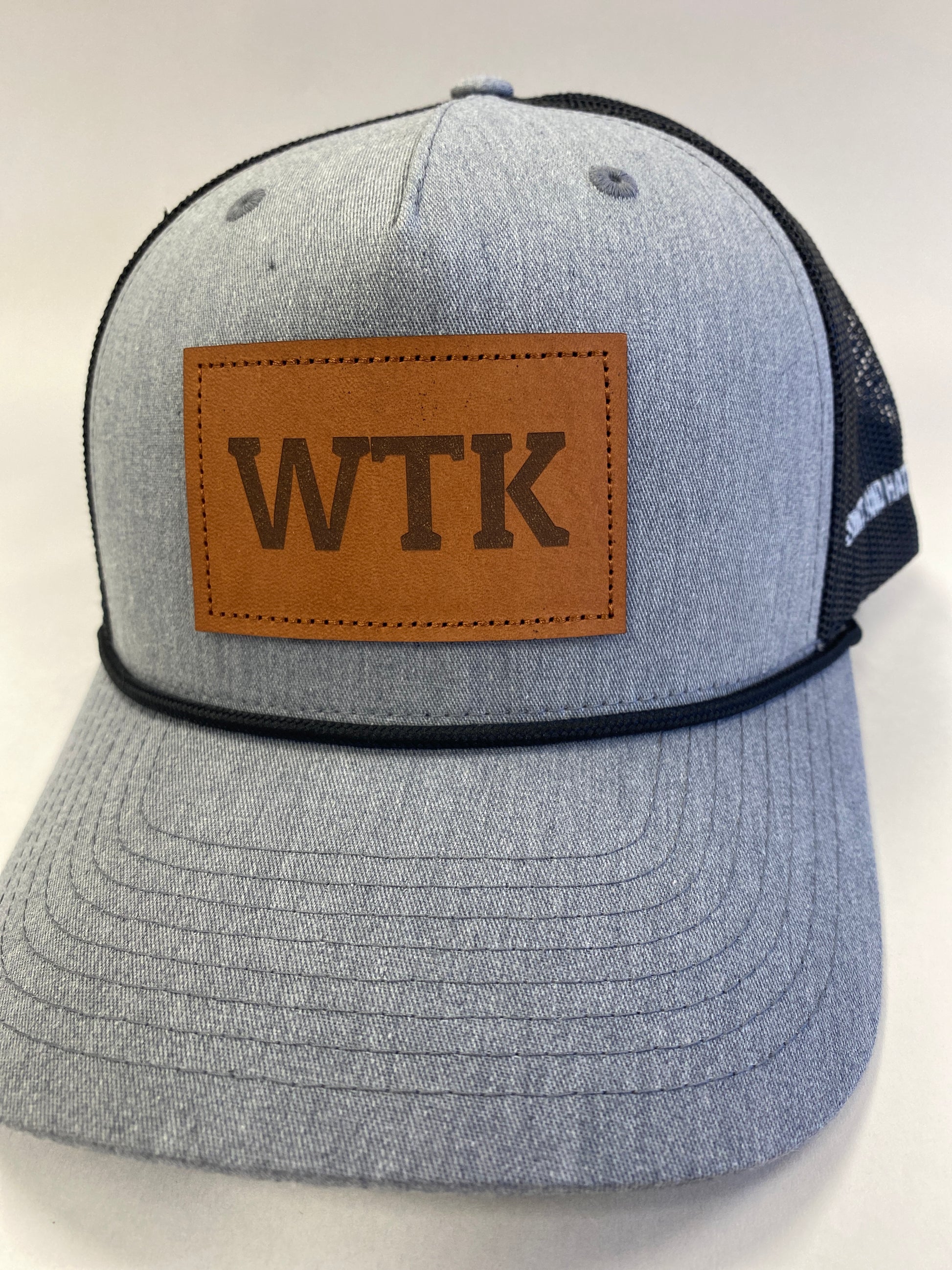 Leather Patch WTK Trucker Hat in black rope