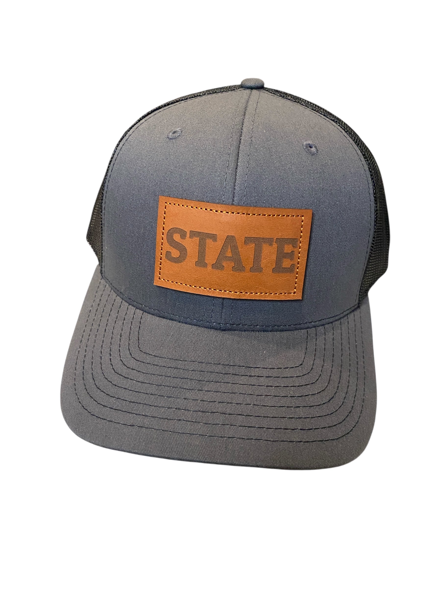 Leather patch STATE Trucker Hat in charcoal/black mesh