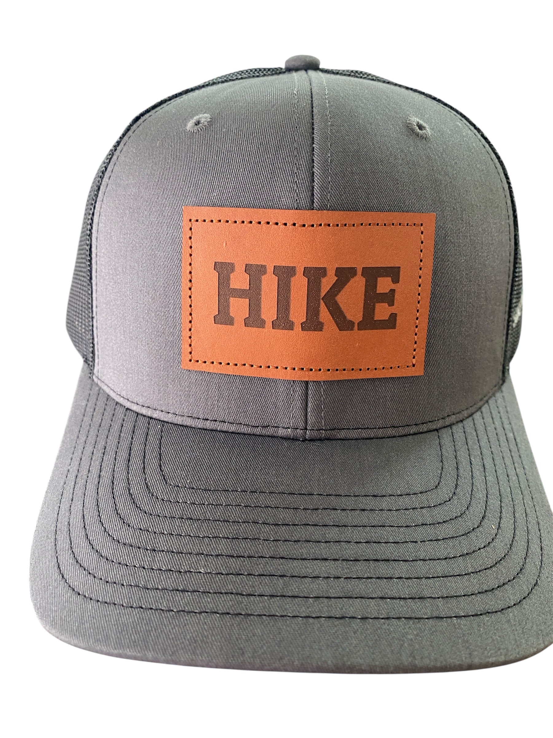 Leather Patch HIKE Trucker Hat in charcoal/