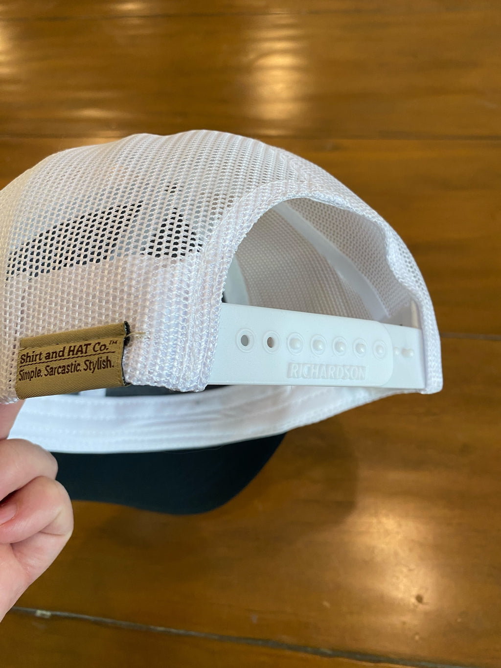 Bulldog Stripes Woven Patch Trucker Hat in black/white mesh