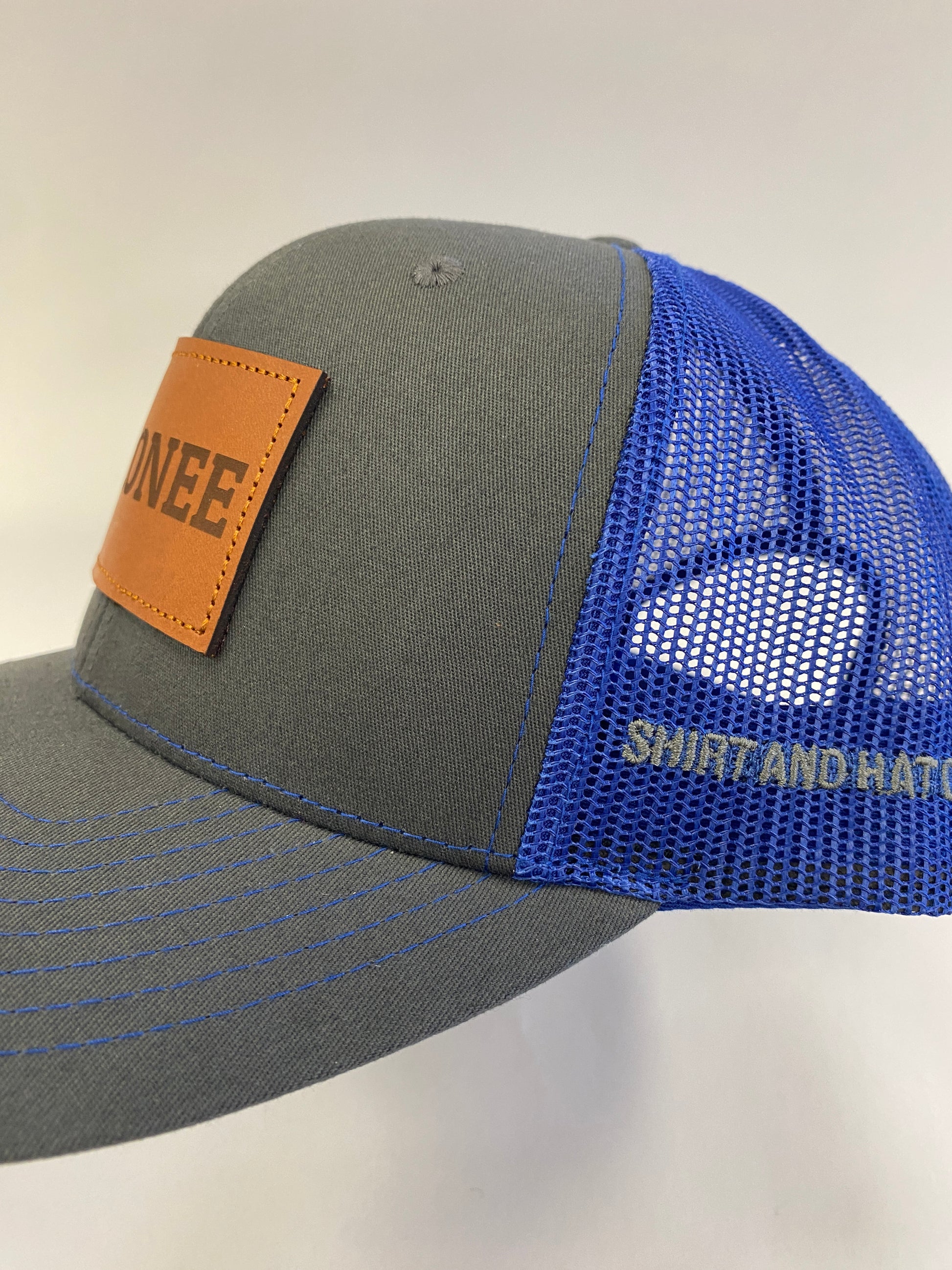 Leather Patch OCONEE Trucker Hat in charcoal/blue