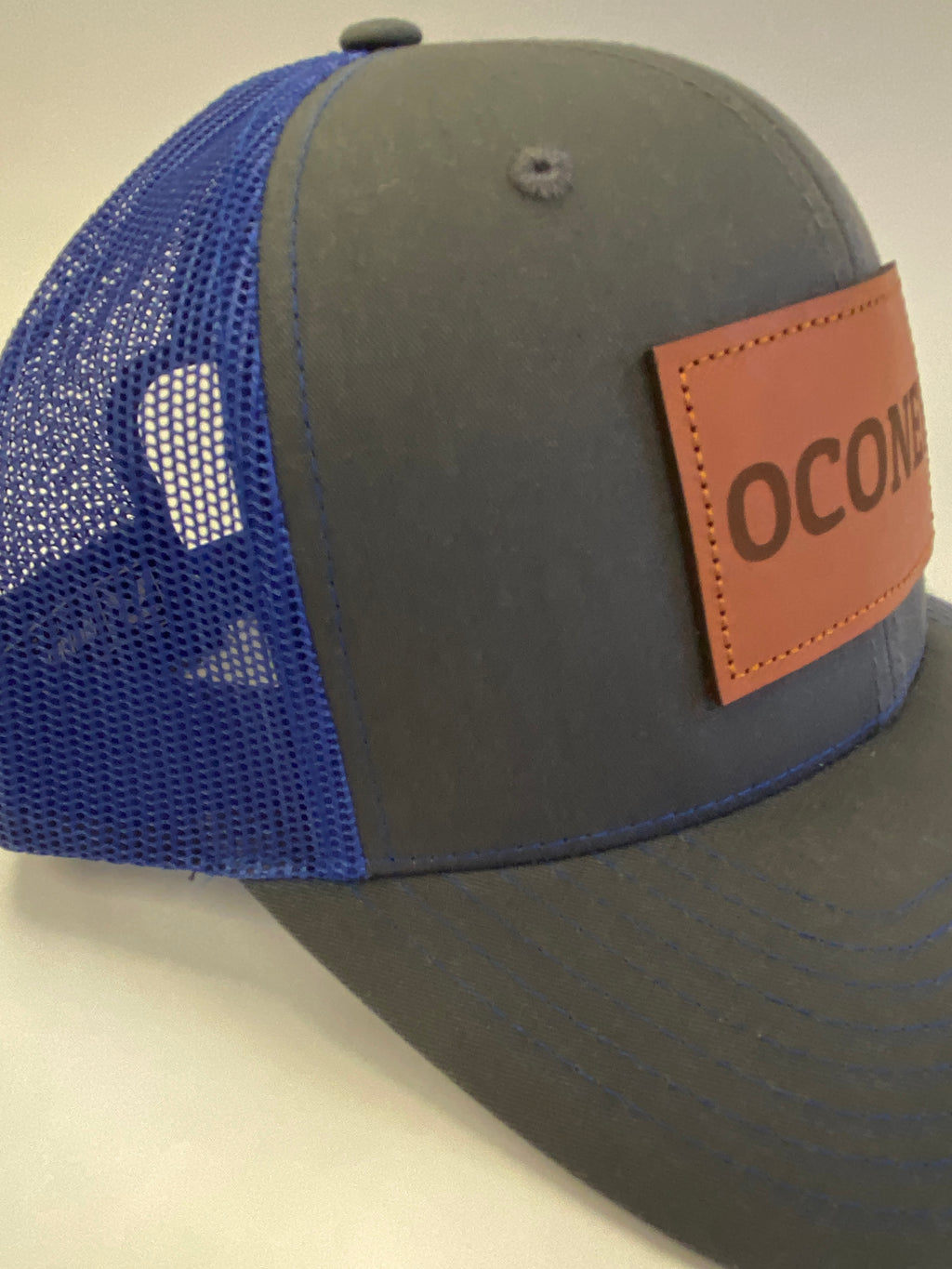Leather Patch OCONEE Trucker Hat in charcoal/blue