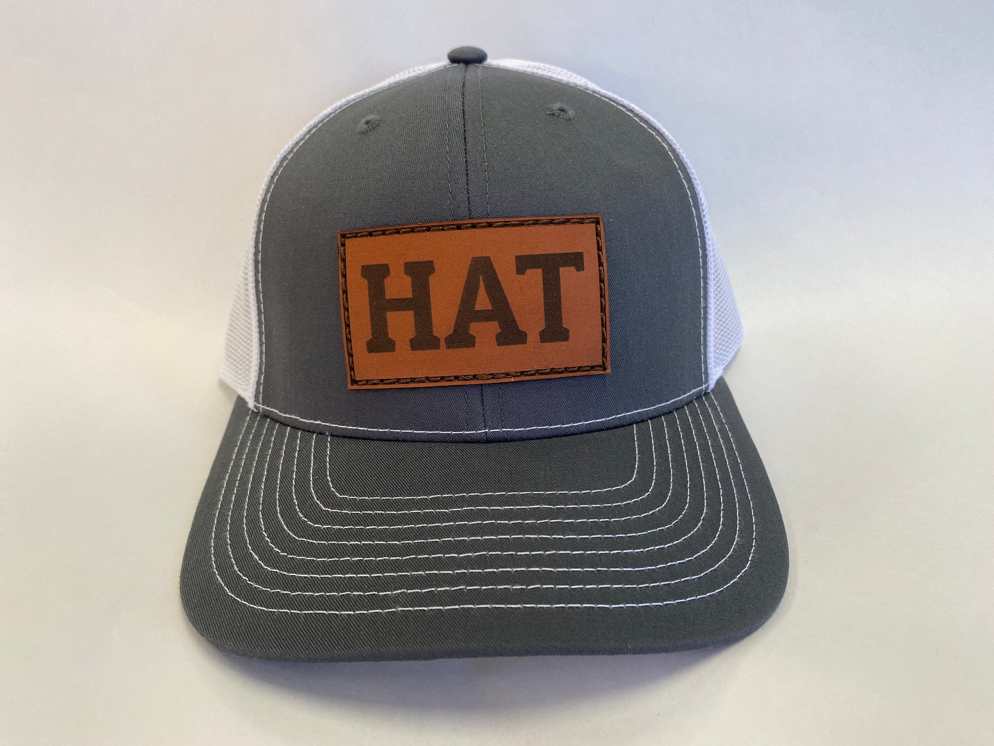 Leather Patch Trucker Hat gray and white