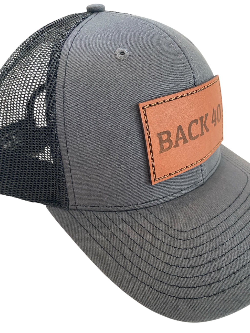 Leather Patch BACK 40 Trucker Hat in charcoal/black