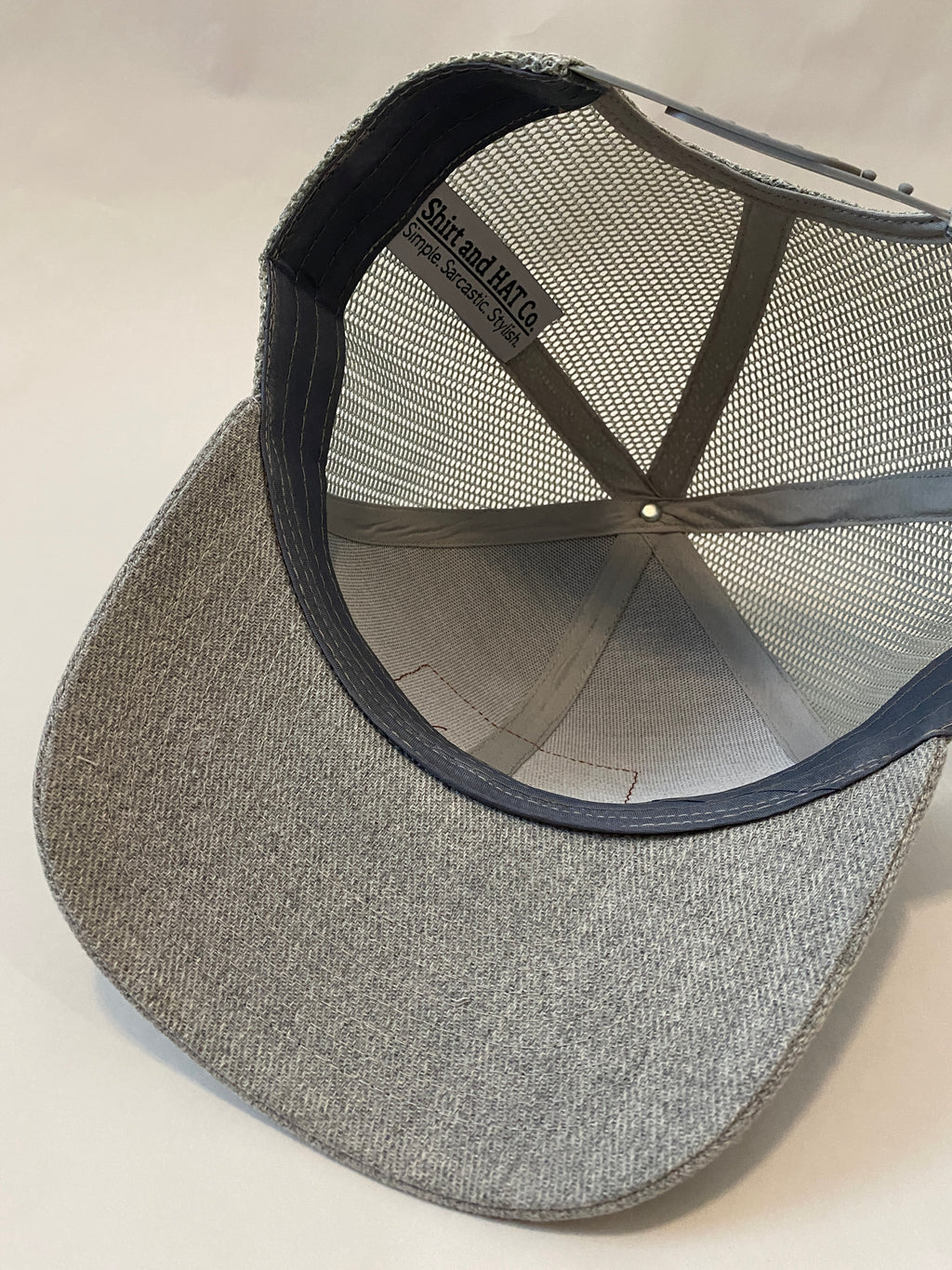 underside of light gray hat